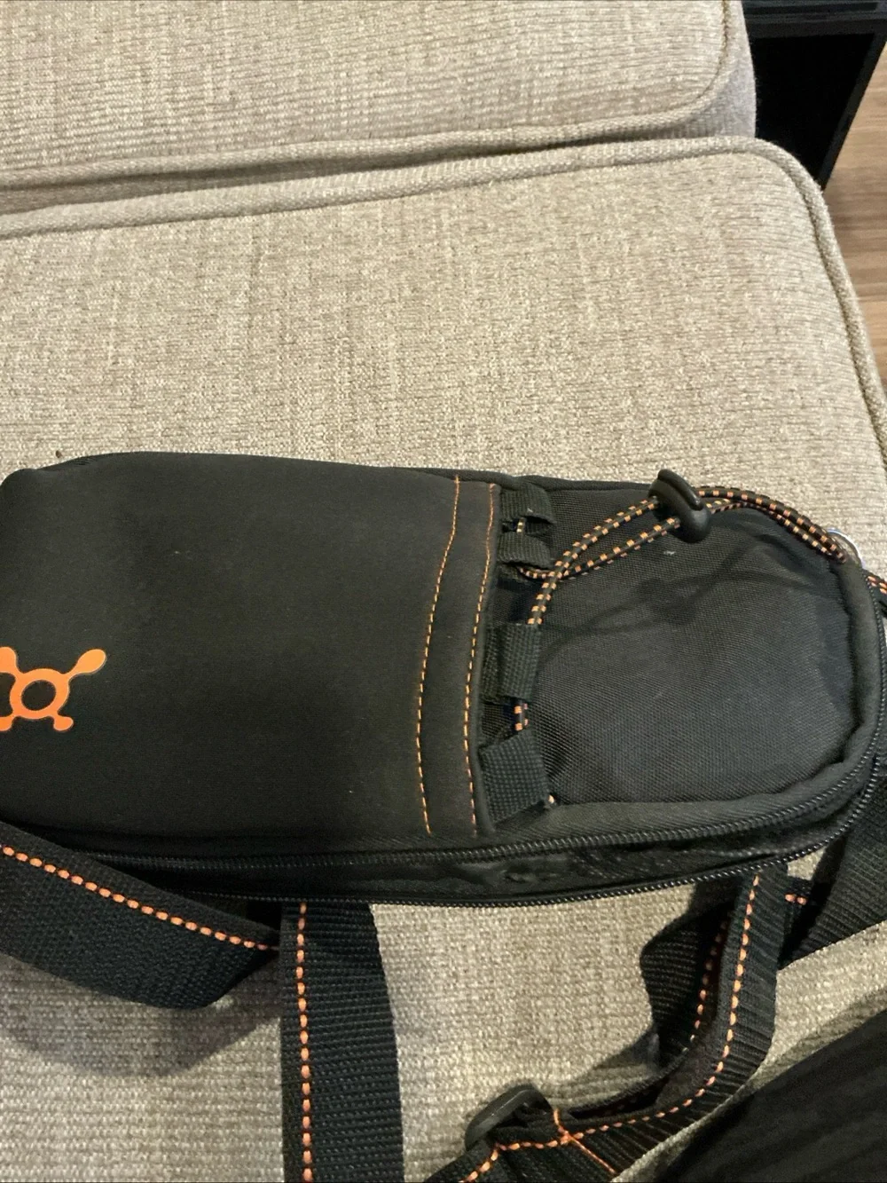 Orangetheory Black Sling Bag with Orange Logo. Bottle holde
